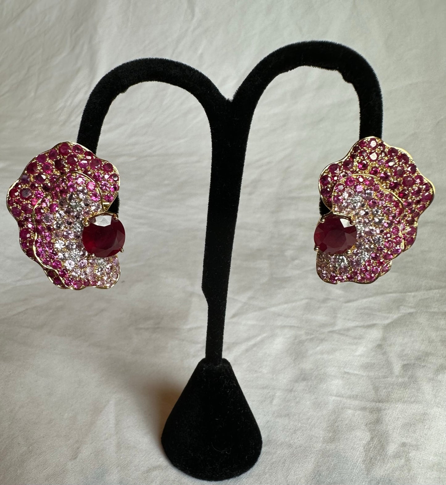 268-23 | 18ky 8 Diamonds @0.22ct, 2 Rubies @13.76ct, 87 Rubies @5.93ct and 177 Pink Sapphires @9.83ct Half Flower Earrings