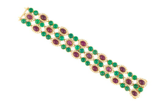 483-40 FXIEXE | 18 K Bulgari, ruby emerald and diamond bracelet