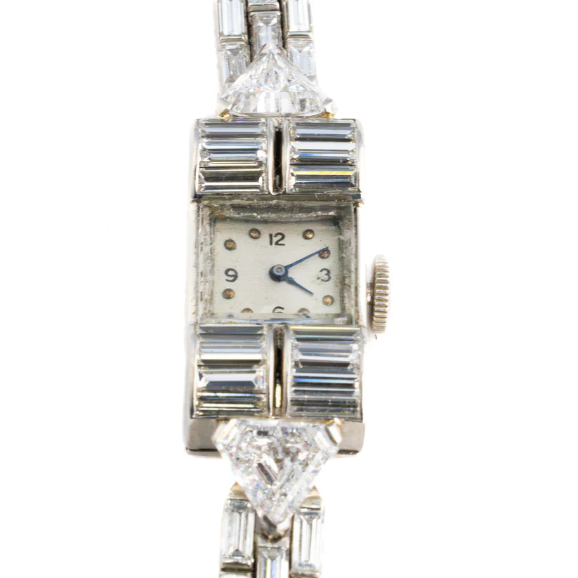 483-43 DEXEX | Harry Winston platinum Diamond cocktail watch with Audemars Piguet movement  84 baguette cut Diamonds 9.43 ct 2 triangular Cat and Diamonds 1.73 ct