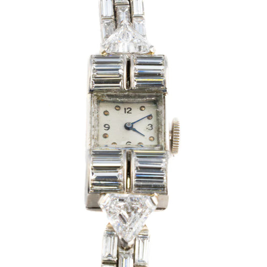 483-43 DEXEX | Harry Winston platinum Diamond cocktail watch with Audemars Piguet movement  84 baguette cut Diamonds 9.43 ct 2 triangular Cat and Diamonds 1.73 ct