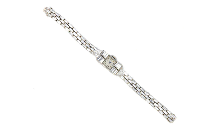 483-43 DEXEX | Harry Winston platinum Diamond cocktail watch with Audemars Piguet movement  84 baguette cut Diamonds 9.43 ct 2 triangular Cat and Diamonds 1.73 ct